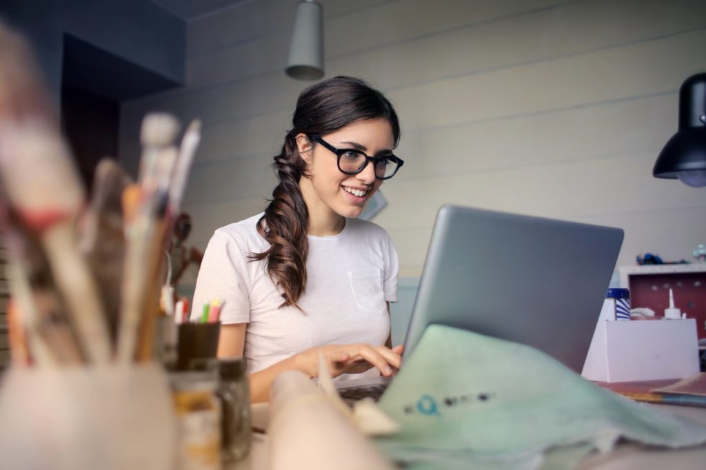 Smiling Woman on Computer - Turner Little